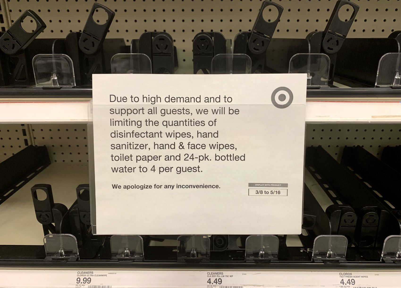 Empty shelves of disinfectatnt wipes, hand sanitizer and toilet paper